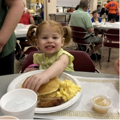 Young guest enjoying a Pancake Day meal in 2019
