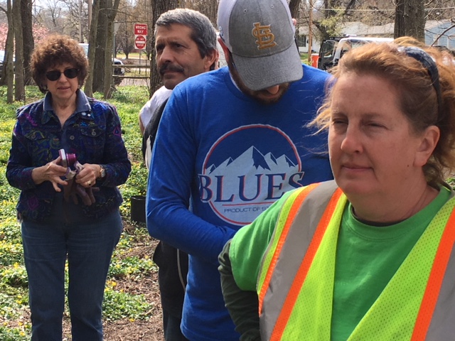 Arbor Day participants standing together at the wooded site