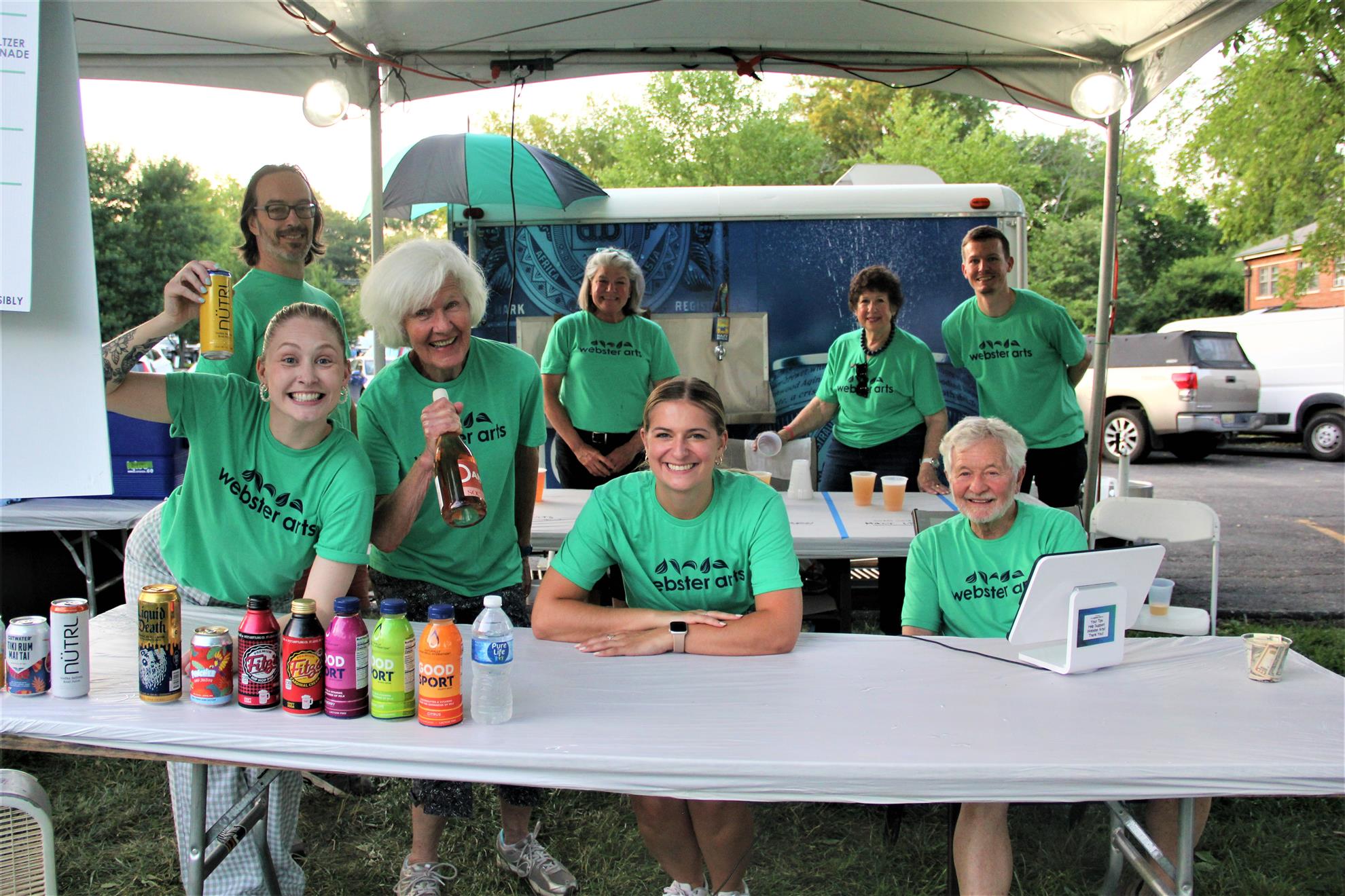 Rotary volunteers staffing the Webster Arts Fair beverage booth